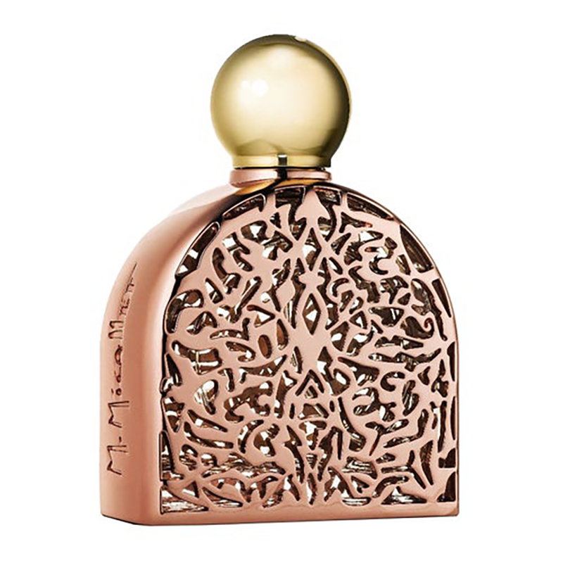 Perfume bottle with intricate design and gold cap on a white background